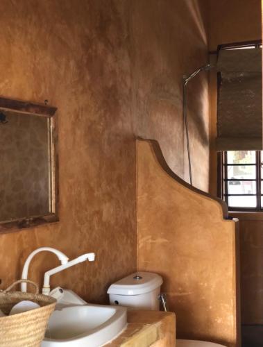 a bathroom with a sink and a toilet at Mlango Paje House II in Paje