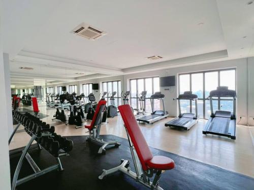 a gym with several treadmills and machines in a room at Spacious 6PX 3BR @ Icon City PJ, Near Sunway & Subang in Petaling Jaya