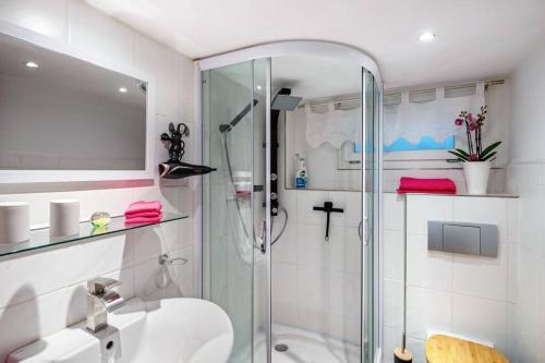 a bathroom with a shower and a sink at Carlchens Casa in Reinhardshagen
