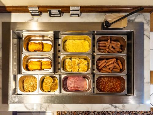 a tray filled with different types of food at Hotel Minerve in Paris