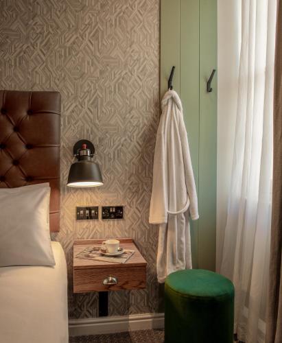 a bedroom with a bed and a table with at Middletons in York