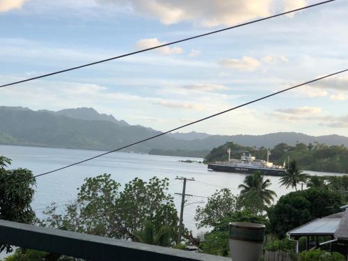 a view of a large body of water with a ferry at Limericks by the Sea in Savusavu