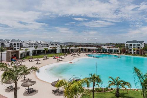 an image of a pool at a resort at Pax's Breathtaking Apartment - The Blyde-Beach in Pretoria