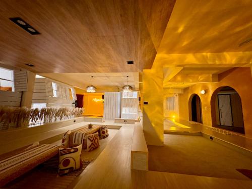 a living room with a couch and a table at perBed Hostel-Taichung Station in Taichung
