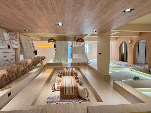 a hotel lobby with a pool and a swimming pool at perBed Hostel-Taichung Station in Taichung