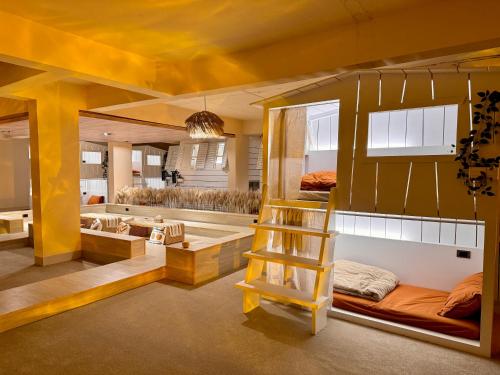 a room with a bunk bed and a ladder at perBed Hostel-Taichung Station in Taichung