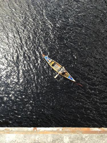 a small boat floating in the water at The Aberlour Hotel in Aberlour