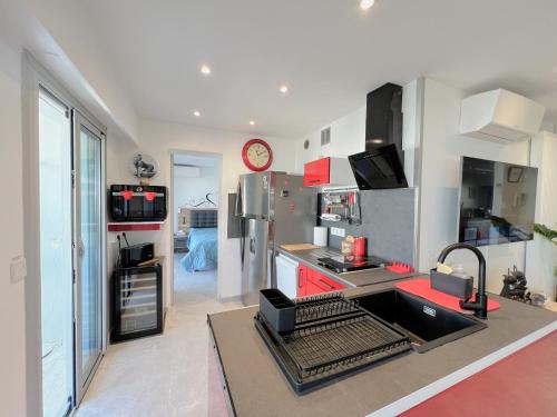 a kitchen with a refrigerator and a counter top at Maryline by Welcome to Cannes in Cannes