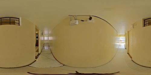 a room with three large mirrors on the floor at Hotel Garden Residency By WB Inn in Bangalore