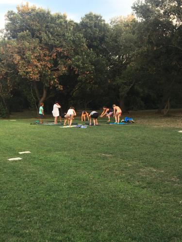 a group of people standing around in a field at Residence Altair - Serra degli Alimini in Otranto