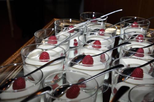 a group of glasses with strawberries in them at Hotel Braunsbergerhof in Lana