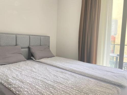 a bed sitting in a bedroom with a window at Jasmin 4 in Alanya
