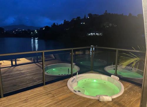 two hot tubs on the deck of a cruise ship at 5CHALETS in Guatapé