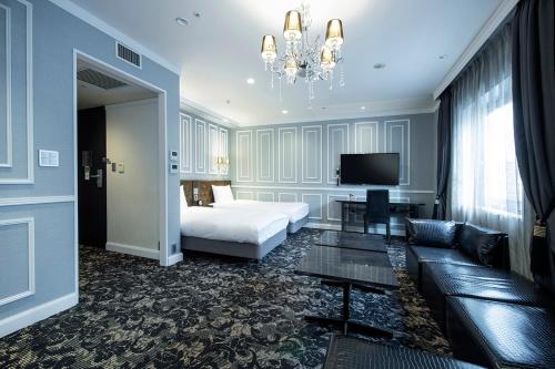 Postel nebo postele na pokoji v ubytování Hotel Plumm