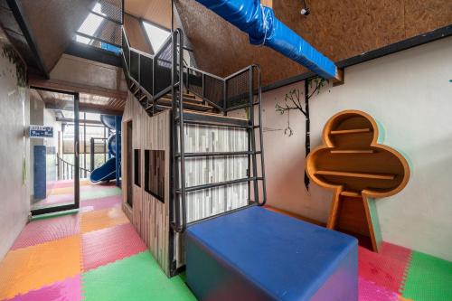 a play room with a slide and a playground at Kokotel Krabi Ao Nang in Ao Nang Beach
