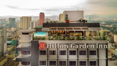 a building with aillin garden inn sign on top of it at Hilton Garden Inn Kuala Lumpur - South in Kuala Lumpur