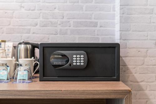 a microwave sitting on top of a counter at Kokotel Krabi Ao Nang in Ao Nang Beach