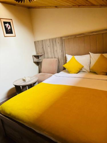 Un ou plusieurs lits dans un hébergement de l'établissement Alex Hotel