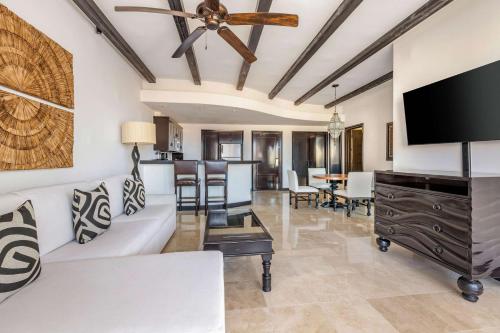 a living room with a couch and a ceiling fan at Hilton Vacation Club Cabo Azul Los Cabos in San José del Cabo