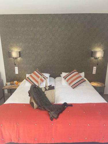 a large bed with a alligator on top of it at Les Loges du Luberon in Coustellet