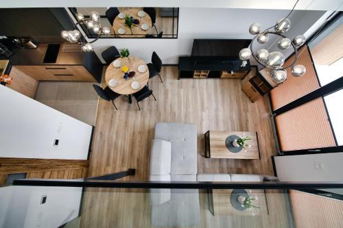 an overhead view of a living room with a table and chairs at Apartamenty Laguna Beskidów - C50 in Zarzecze