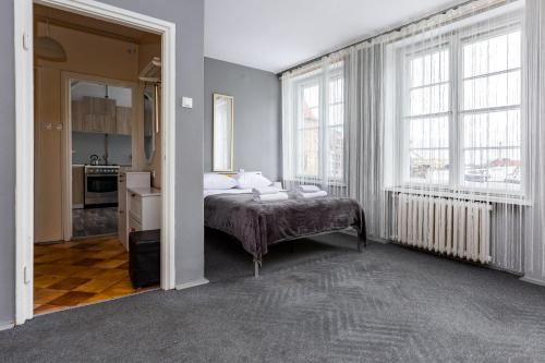 מיטה או מיטות בחדר ב-Targ Rybny Standard Apartment