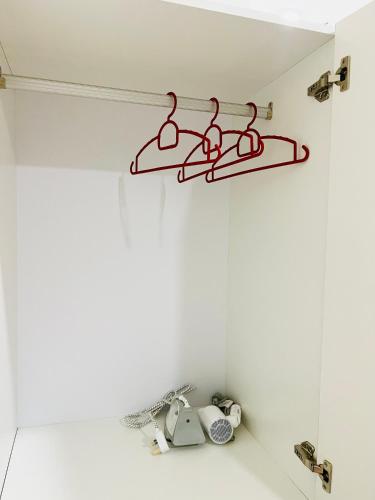a shelf in a room with a white wall at C&Y Horizon Suites Homestay Sepang - KLIA Transit - Near XiaMen University in Kampong Melot