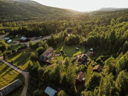 an aerial view of a village in a forest at Vikinggård Cottages in Höljes