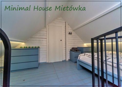 a bedroom with a bed in a attic at Miętówka in Godziszka