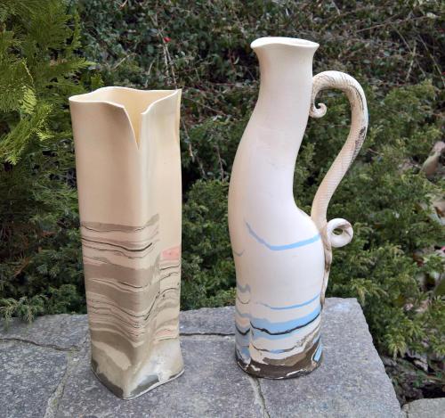 two vases are sitting next to each other at Apartmány U Orlického jezera - Kamenice in Klučenice