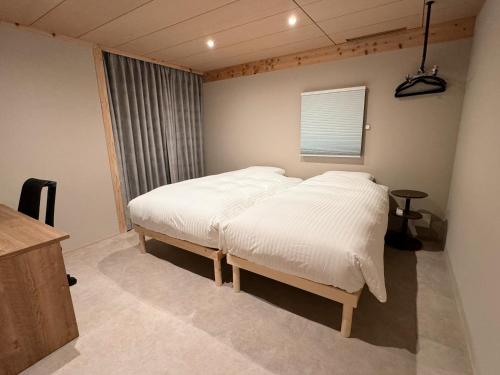 Postel nebo postele na pokoji v ubytování ARTISANAL
