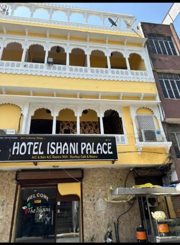 a hotel ishtar palace sign on the side of a building at Hotel the ishani palace in Udaipur