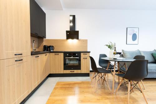 Kuchyň nebo kuchyňský kout v ubytování River Song Apartment