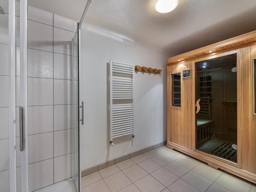 a bathroom with a shower and a glass door at Chalet Courchevel 1550, 6 pièces, 8 personnes - FR-1-562-44 in Courchevel