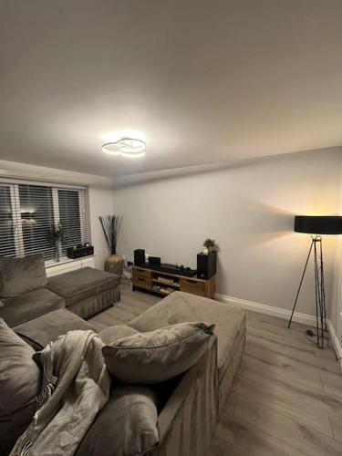 a living room with a couch and a table at Aycliffe Home Away From Home A1 in Newton Aycliffe