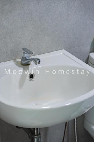 a white sink in a bathroom next to a toilet at Cozy&Comfy Suite Room Perai in Perai