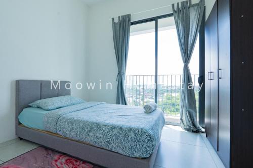 a bedroom with a bed and a large window at Cozy&Comfy Suite Room Perai in Perai