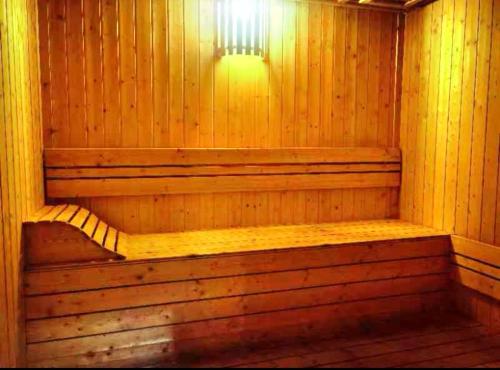 a wooden sauna with a light on top of it at Cozy&Comfy Suite Room Perai in Perai