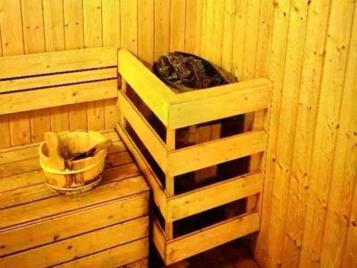 a cabin with a cat sitting in a sauna at Cozy&Comfy Suite Room Perai in Perai