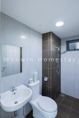 a bathroom with a white toilet and a sink at Cozy&Comfy Suite Room Perai in Perai
