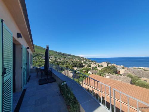 a balcony of a house with a view of the ocean at VILLA ELBA in Brando