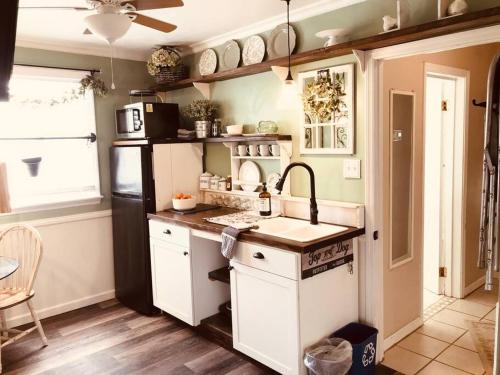 a kitchen with a sink and a stove at Cozy Woodbrook Apartment B in Dover