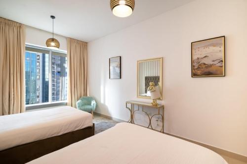 Postel nebo postele na pokoji v ubytování Bellavista - Boho Chic - 2BR - 29 Boulevard Burj Khalifa & Fountain Views