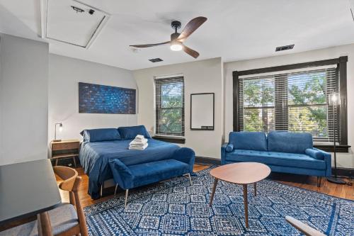 a living room with blue couches and a couch at Spacious, Historic Logan Circle Rowhouse in Washington