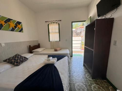 Postel nebo postele na pokoji v ubytování Pousada Prisma Paraty