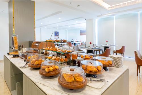 a buffet line with many different types of food at Erfad Hotel - Riyadh in Riyadh