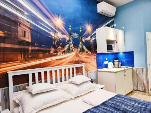 a bedroom with a wall mural of a city at King Apartment in Budapest