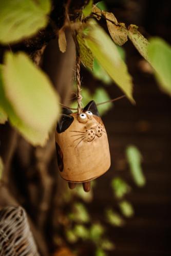 a cat ornament hanging from a tree at Villa Knoche in Arnsberg