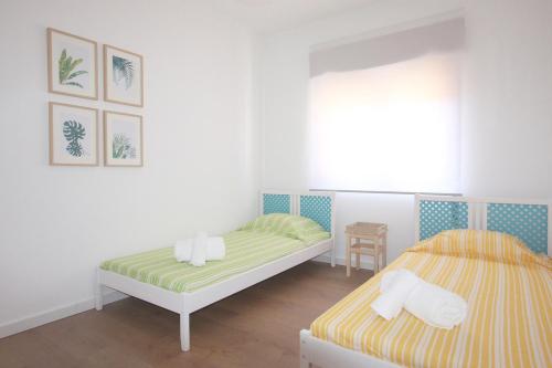 Postel nebo postele na pokoji v ubytování Apartment Jara, Tavira