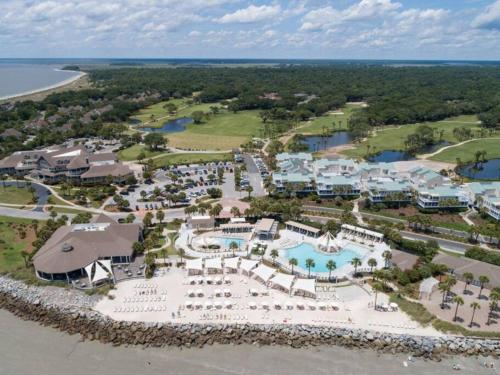 an aerial view of the resort and the beach at Palmetto Breeze, Golf Course New furniture, carpet in Johns Island
